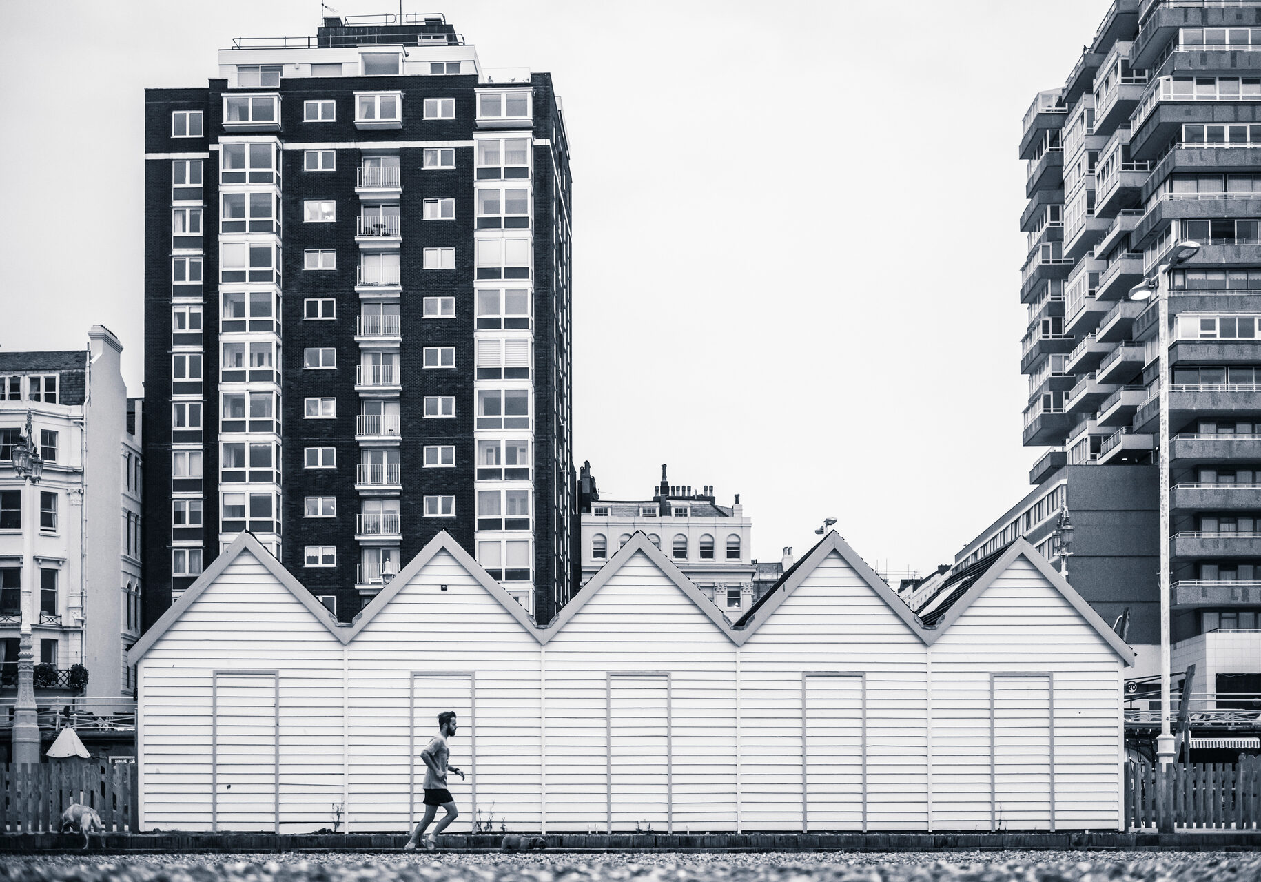 England Travel Photography Jogging on Brighton Beach Brighton and Hove East Sussex England
