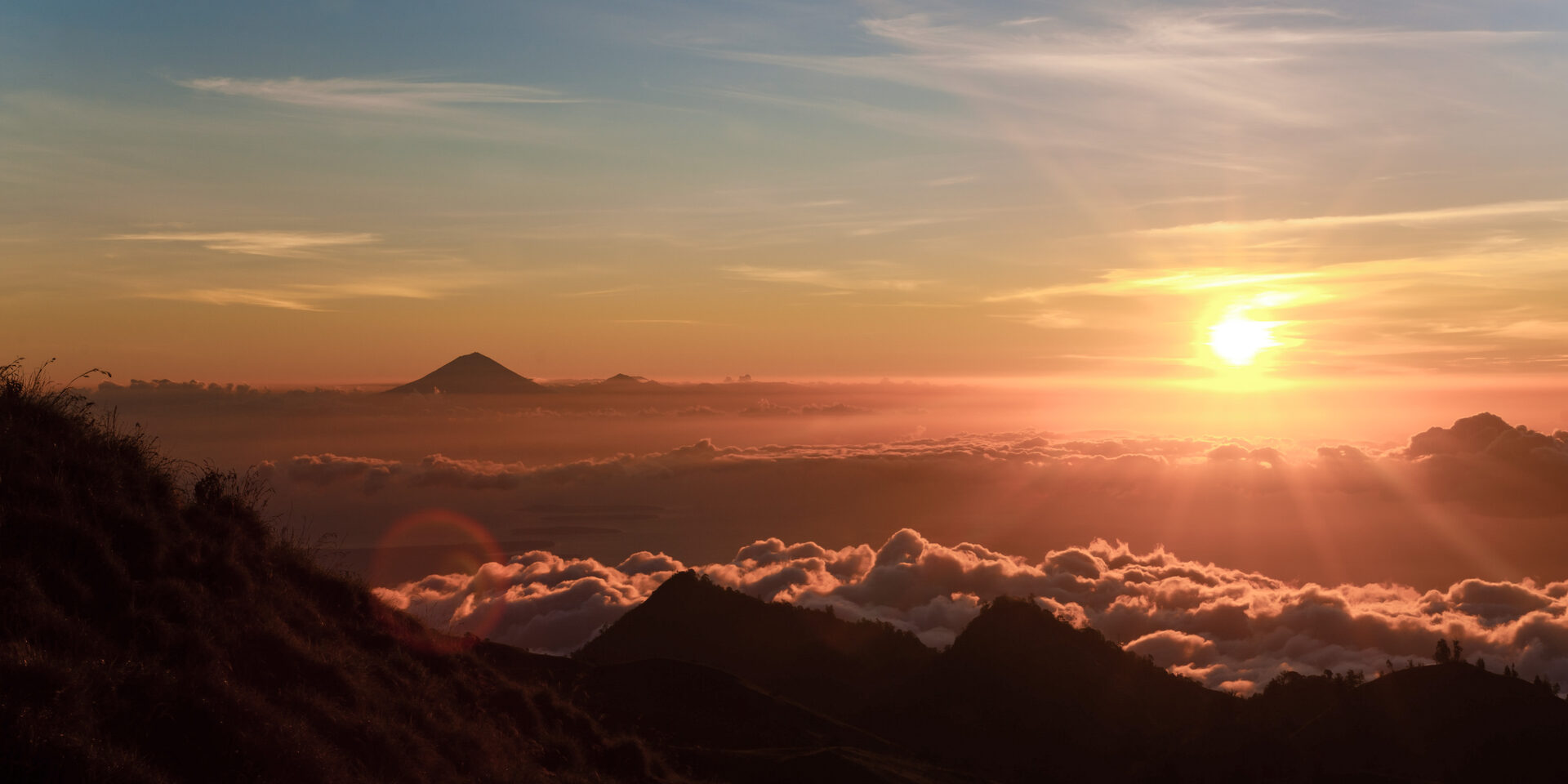 Indonesia Landscape Travel Photography Sunset on the First Day Climbing Mount Rinjani with Mount Agung in the Distance Lombok Indonesia Asia