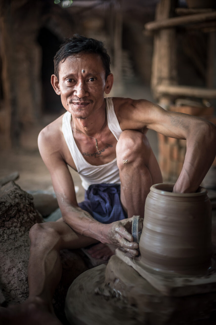 Myanmar Burma Portrait Travel Photography Documentary Portraiture Portrait of a potter in an Oh Bo pottery shed Twante near Yangon Myanmar Burma 2